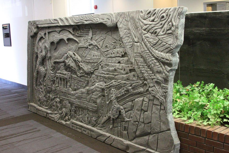 Illustration for article titled Skyrim's Giant Dragon Wall, Installed on a Regular Office Wall
